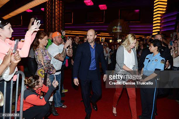 Jason Strathan signs autographs for fans ath the "Homefront" premiere at Planet Hollywood Resort & Casino on November 20, 2013 in Las Vegas, Nevada.