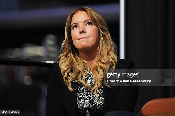 Los Angeles Lakers president of business operations Jeanie Buss watches a video tribute to her father Jerry Buss on the jumbotron during the Los...
