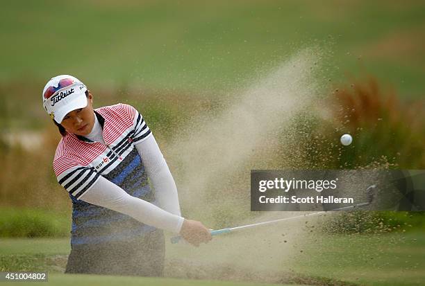 Amy Yang of South Korea plays a bunker shot on the 17th hole during the third round of the 69th U.S. Women's Open at Pinehurst Resort & Country Club,...