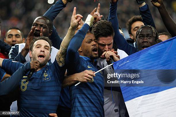 Mathieu Valbuena, Patrice Evra, Olivier Giroud and Bacary Sagna of France sing the Marseillaise after they won the FIFA 2014 World Cup Qualifier 2nd...