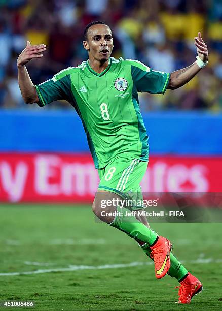 Peter Odemwingie of Nigeria celebrates scoring his team's first goal during the 2014 FIFA World Cup Brazil Group F match between Nigeria and...