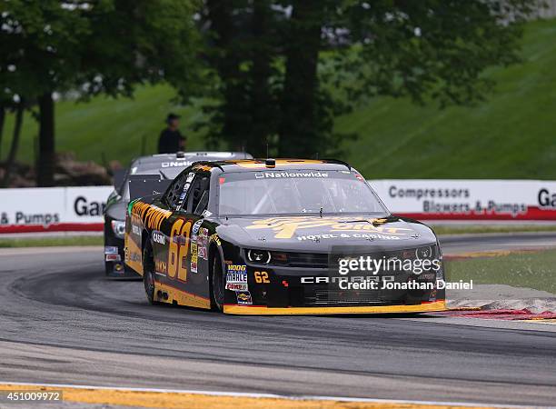 Brendan Gaughan, driver of the South Point Chevrolet, leads Sam Hornish, Jr., driver of the Monster Energy Toyota, through a turn during the Gardner...