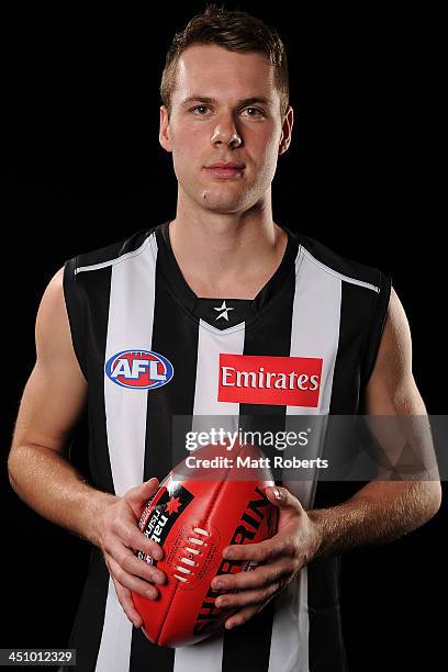 Matthew Scharenberg poses for a photograph after being drafted to Collingwood during the 2013 NAB AFL Draft on November 21, 2013 on the Gold Coast,...