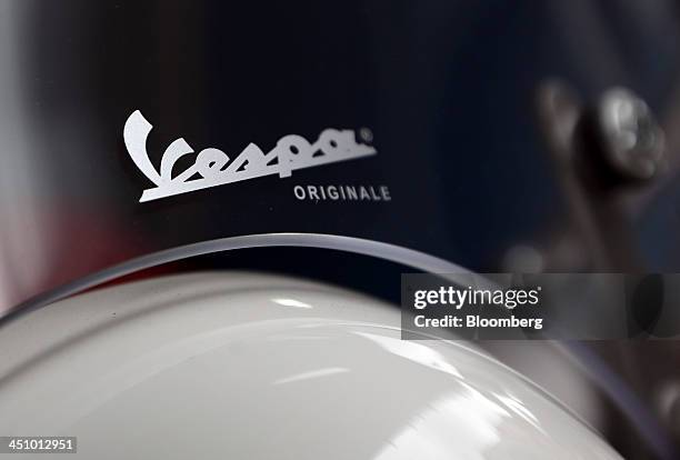 Logo sits on the windshield of a Vespa 946 scooter, manufactured by Piaggio & C. SpA, in this arranged photograph taken in London, U.K., on...