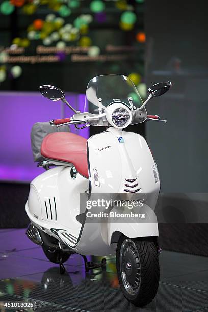 New Vespa 946 scooter, manufactured by Piaggio & C. SpA, sits on display in this arranged photograph taken in London, U.K., on Wednesday, Nov. 20,...