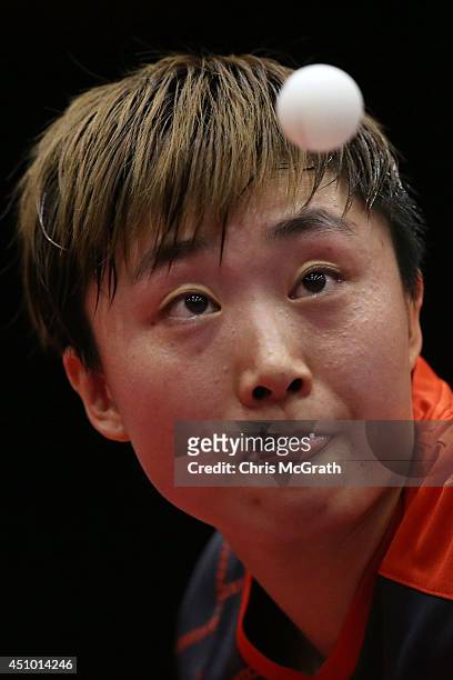 Feng Tianwei of Singapore serves against Li Fen of Sweden during their Women's Singles Semi final match on day three of 2014 ITTF World Tour Japan...
