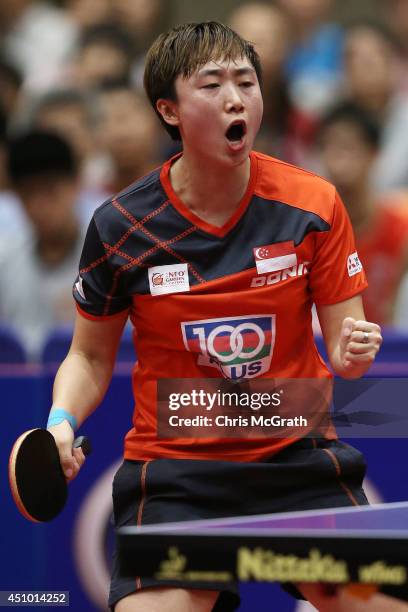 Feng Tianwei of Singapore celebrates a point against Li Fen of Sweden during their Women's Singles Semi final match on day three of 2014 ITTF World...