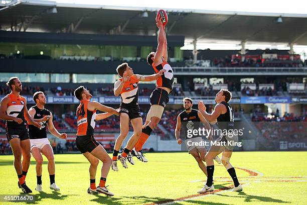 Shane Mumford of the Giants takes a mark during the round 14 AFL match between the Greater Western Sydney Giants and the Carlton Blues at Spotless...