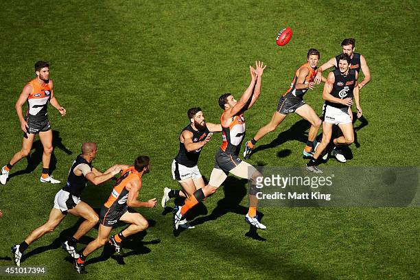 Shane Mumford of the Giants competes for a mark during the round 14 AFL match between the Greater Western Sydney Giants and the Carlton Blues at...