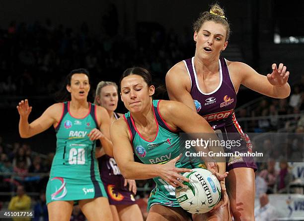 Madi Robinson of the Vixens and Gabi Simpson of the Firebirds compete for the ball during the ANZ Championship Grand Final match between the Vixens...