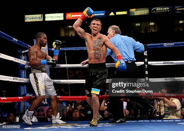 Vasyl Lomachenko celebrates after the final bell against Gary Russell Jr. In their WBO Featherwieight Title bout at StubHub Center on June 21, 2014...