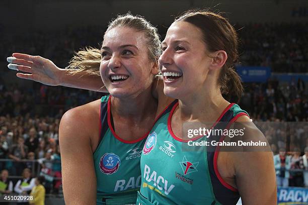 Liz Watson and Madi Robinson of the Vixens embrace following victory in the ANZ Championship Grand Final match between the Vixens and the Firebirds...
