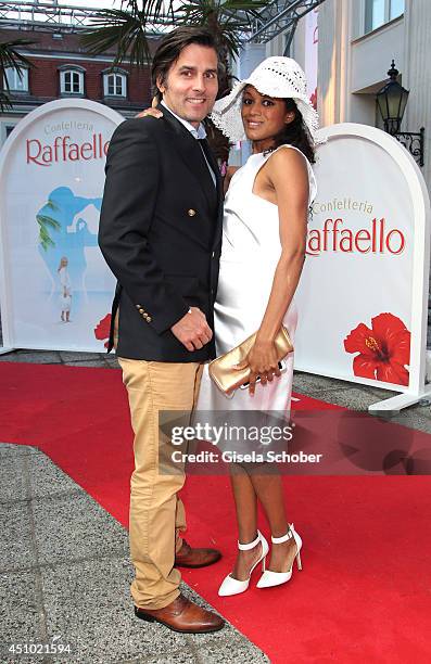 Milka Loff Fernandes and her husband Robert Irschara attend the Raffaello Summer Day 2014 at Kronprinzenpalais on June 21, 2014 in Berlin, Germany.