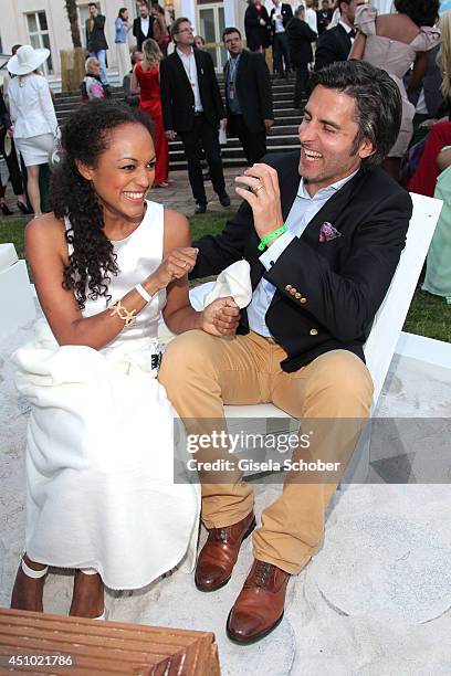 Milka Loff Fernandes and her husband Robert Irschara attend the Raffaello Summer Day 2014 at Kronprinzenpalais on June 21, 2014 in Berlin, Germany.