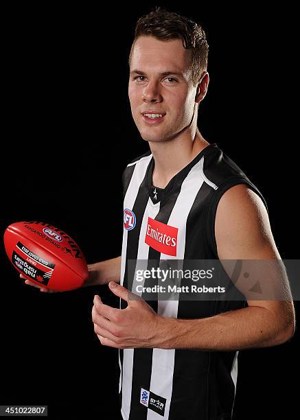 Matthew Scharenberg poses for a photograph after being drafted to Collingwood during the 2013 NAB AFL Draft on November 21, 2013 on the Gold Coast,...