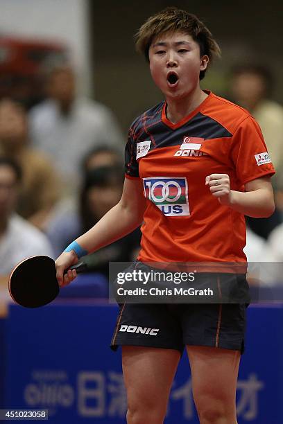 Feng Tianwei of Singapore celebrates winning a point against Ishikawa Kasumi of Japan during the Women's Singles Final against Feng Tianwei of...