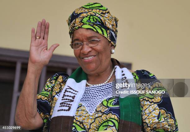 Liberia's President Ellen Johnson Sirleaf, who jointly won the Nobel Peace Prize 2011 today, waves to supporters on october 7, 2011 at her house in...