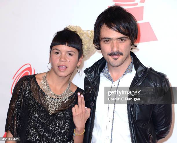 Singers Liliana Saumet and Simon Mejia of Bomba Estereo arrive at the 2013 Latin Recording Academy Person Of The Year Tribute Honoring Miguel Bose at...