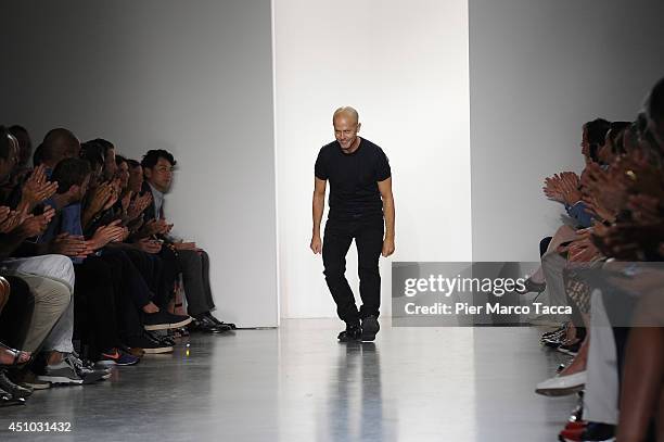 Italo Zucchelli acknowledges the applause of the audience after the Calvin Klein Collection show during Milan Fashion Week Menswear Spring/Summer...