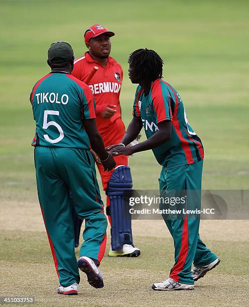 Shem Ngoche of Kenya is congratulated by Steve Tikolo, after bowling Dion Stovell of Bermuda during the ICC World Twenty20 Qualifier match between...