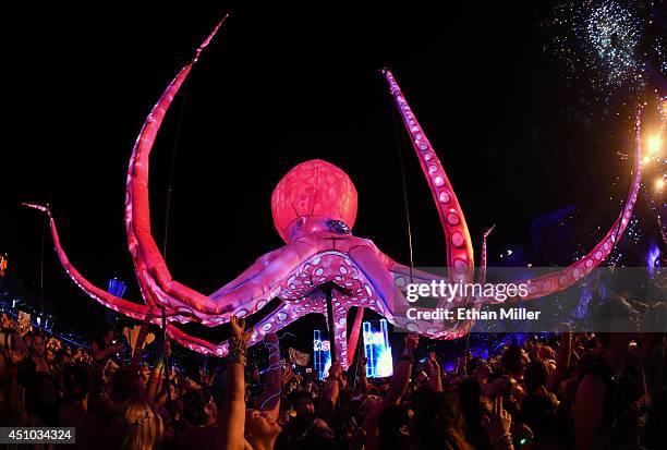 Performers carry an octopus puppet through the crowd during a set by Kaskade at the 18th annual Electric Daisy Carnival at Las Vegas Motor Speedway...