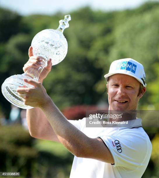 Mikko Ilonen of Finland celebrates with the winners trophy after the final round of the Irish Open at the Fota Island Resort on June 22, 2014 in...