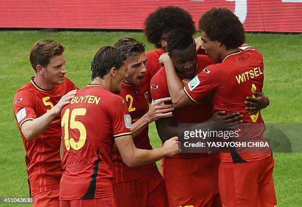 Belgium's forward Divock Origi celebrastes his goal against Russia with teammates during a Group H football match between at the Maracana Stadium in...