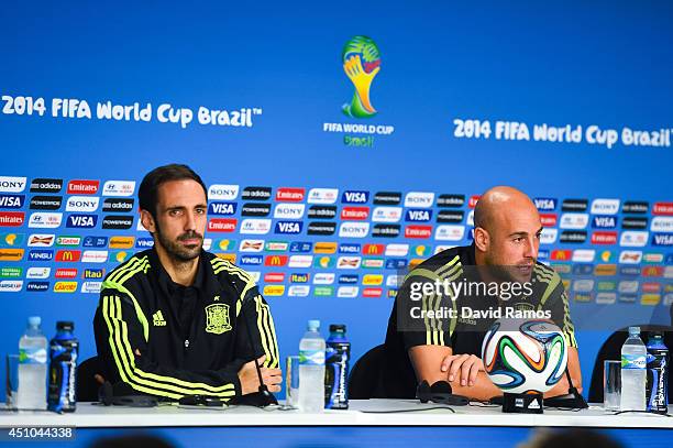 Juanfran and Pepe Reina of Spain face the media during a Spain press conference ahead of the 2014 FIFA World Cup Group B match between Australia and...