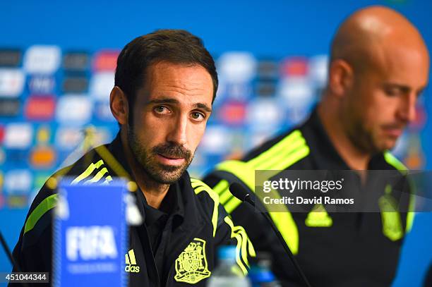 Juanfran and Pepe Reina of Spain face the media during a Spain press conference ahead of the 2014 FIFA World Cup Group B match between Australia and...