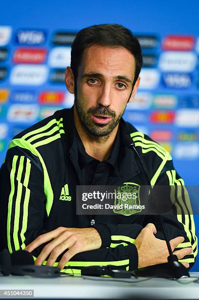 Juanfran of Spain faces the media during a Spain press conference ahead of the 2014 FIFA World Cup Group B match between Australia and Spain at Arena...