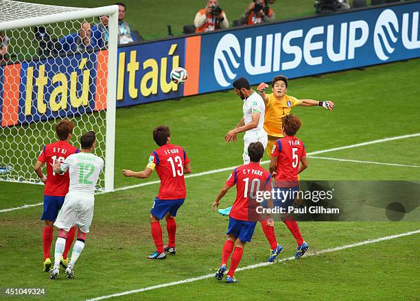 Rafik Halliche of Algeria scores his team's second goal on a header past Jung Sung-Ryong of South Korea during the 2014 FIFA World Cup Brazil Group H...