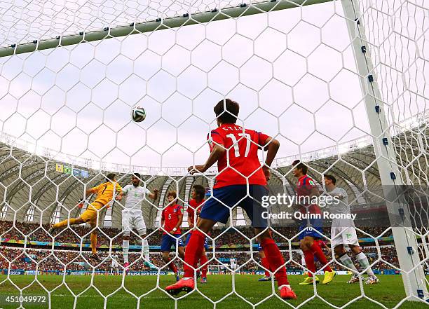 Rafik Halliche of Algeria scores his team's second goal on a header past goalkeeper Jung Sung-Ryong and Lee Chung-Yong of South Korea during the 2014...