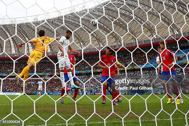 Rafik Halliche of Algeria scores his team's secong goal on a header past Jung Sung-Ryong of South Korea during the 2014 FIFA World Cup Brazil Group H...