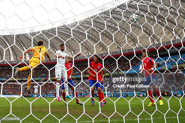 Rafik Halliche of Algeria scores his team's secong goal on a header past Jung Sung-Ryong of South Korea during the 2014 FIFA World Cup Brazil Group H...