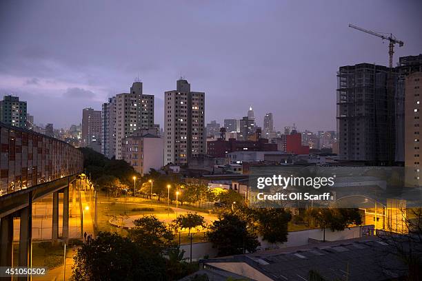 The Sao Paulo skyline is seen at dusk from the 'Bras' Metro station on June 21, 2014 in Sao Paulo, Brazil.