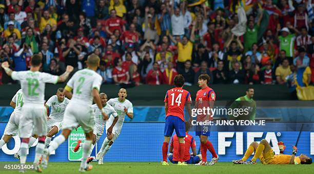 Algeria's midfielder Yacine Brahimi celebrates scoring with teammates as South Korea's midfielder Han Kook-Young , South Korea's defender Hong...