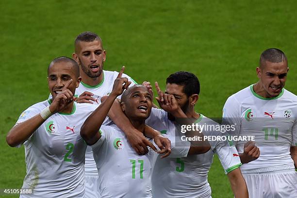 Algeria's midfielder Yacine Brahimi celebrates with teammates after scoring his team's fourth goal during the Group H football match between South...