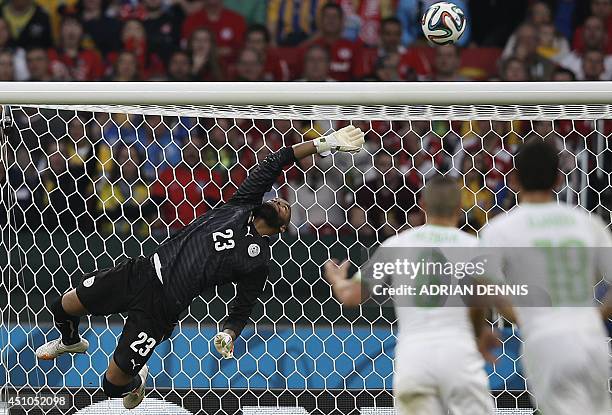 Algeria's goalkeeper Rais Mbohli makes a save during a Group H football match between South Korea and Algeria at the Beira-Rio Stadium in Porto...