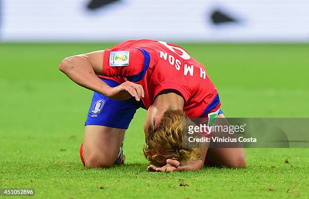 Son Heung-Min of South Korea reacts after being defeated by Algeria 4-2 during the 2014 FIFA World Cup Brazil Group H match between South Korea and...