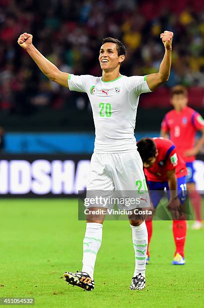 Aissa Mandi of Algeria celebrates after defeating South Korea 4-2 during the 2014 FIFA World Cup Brazil Group H match between South Korea and Algeria...