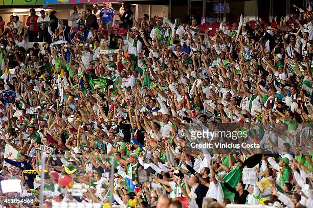Fans cheer during the 2014 FIFA World Cup Brazil Group H match between South Korea and Algeria at Estadio Beira-Rio on June 22, 2014 in Porto Alegre,...