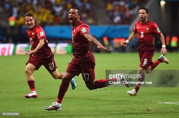Nani of Portugal celebrates scoring his team's first goal with teammates Joao Pereira and Joao Moutinho of Portugal during the 2014 FIFA World Cup...