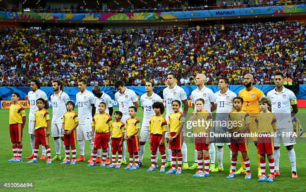 The United States players line up for the national anthem prior to the 2014 FIFA World Cup Brazil Group G match between USA and Portugal at Arena...