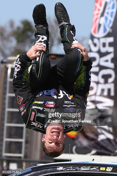 Carl Edwards, driver of the Aflac Ford, celebrates with a backflip after winning the NASCAR Sprint Cup Series Toyota/Save Mart 350 at Sonoma Raceway...