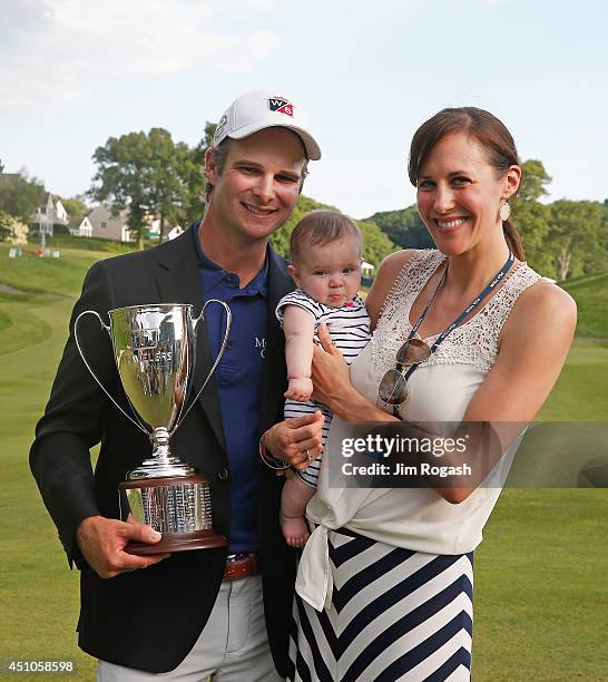 Kevin Streelman of the United States with daughter Sophia and wife Courtney after winning the Travelers Championship golf tournament at the TPC River...