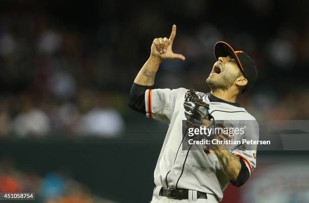 Relief pitcher Sergio Romo of the San Francisco Giants celebrates after defeating the Arizona Diamondbacks in the MLB game at Chase Field on June 22,...