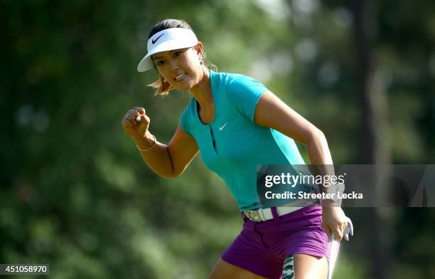 Michelle Wie of the United States celebrates a birdie putt on the 17th hole during the final round of the 69th U.S. Women's Open at Pinehurst Resort...