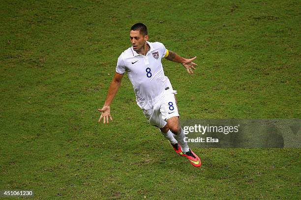 Clint Dempsey of the United States celebrates after scoring his team's second goal during the 2014 FIFA World Cup Brazil Group G match between the...