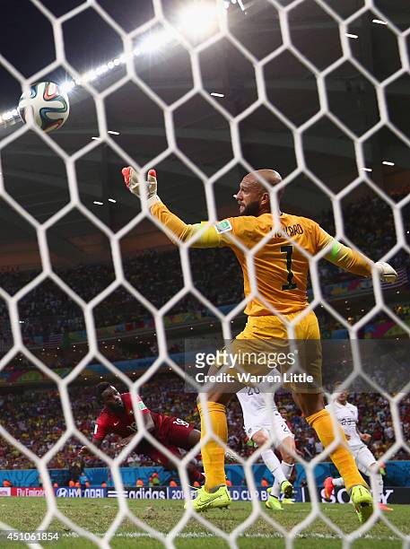 Silvestre Varela of Portugal scores his team's second goal on a header past Tim Howard of the United States during the 2014 FIFA World Cup Brazil...