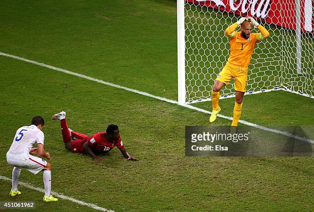 Silvestre Varela of Portugal scores his team's second goal as goalkeeper Tim Howard of the United States looks on during the 2014 FIFA World Cup...